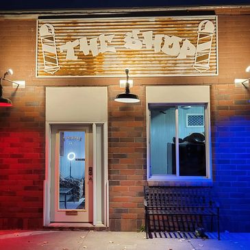 The Shop exterior at night